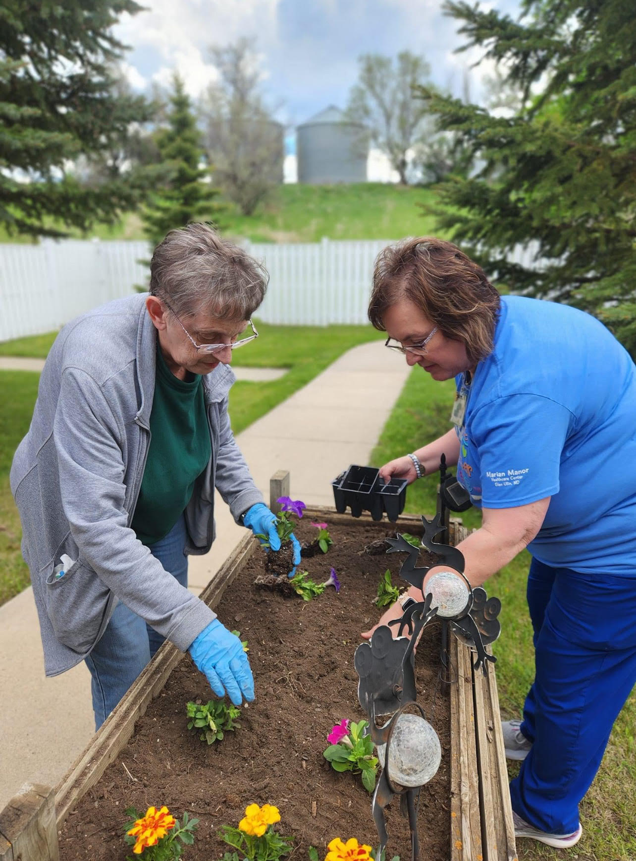 staff and resident gardening